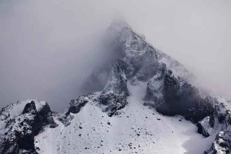 The peak of Mount Thielsen shrouded in clouds.
